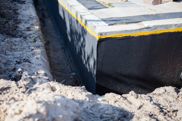 Professional Waterproofing technician working in Pound, WI